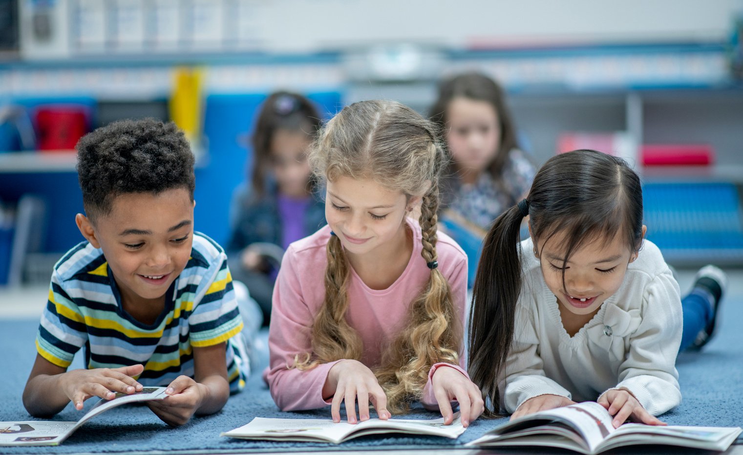 Elementary Students Reading Together stock photo